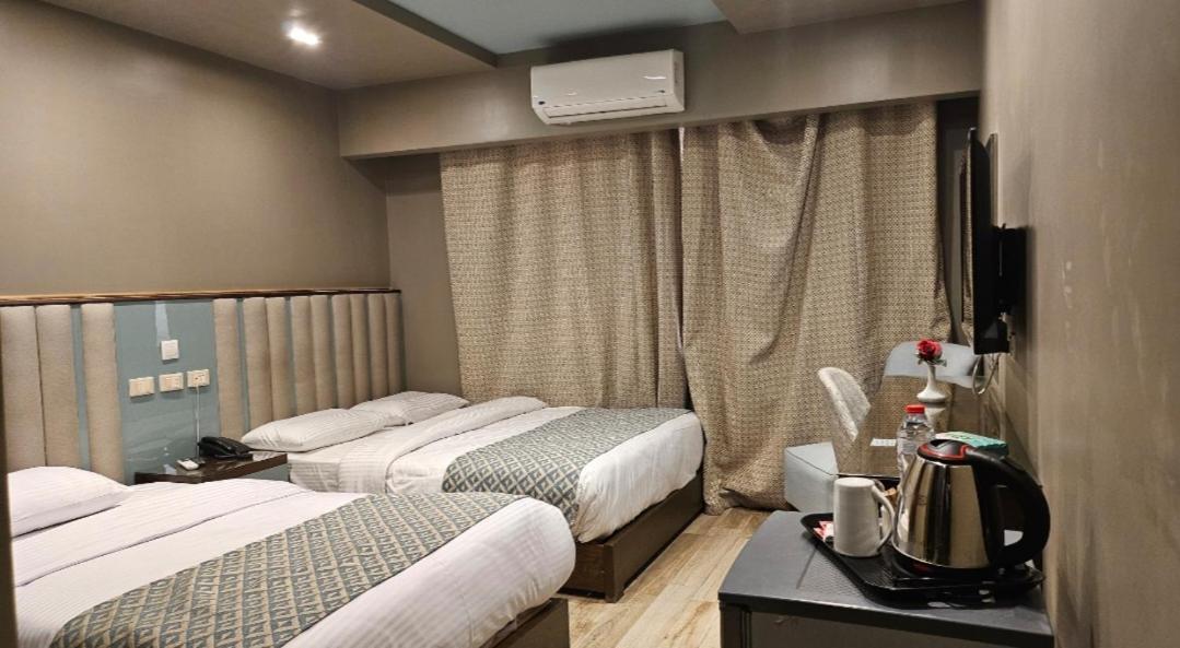 Grand Bayan Hotel & Apt At Nile Plaza カイロ 部屋 写真
