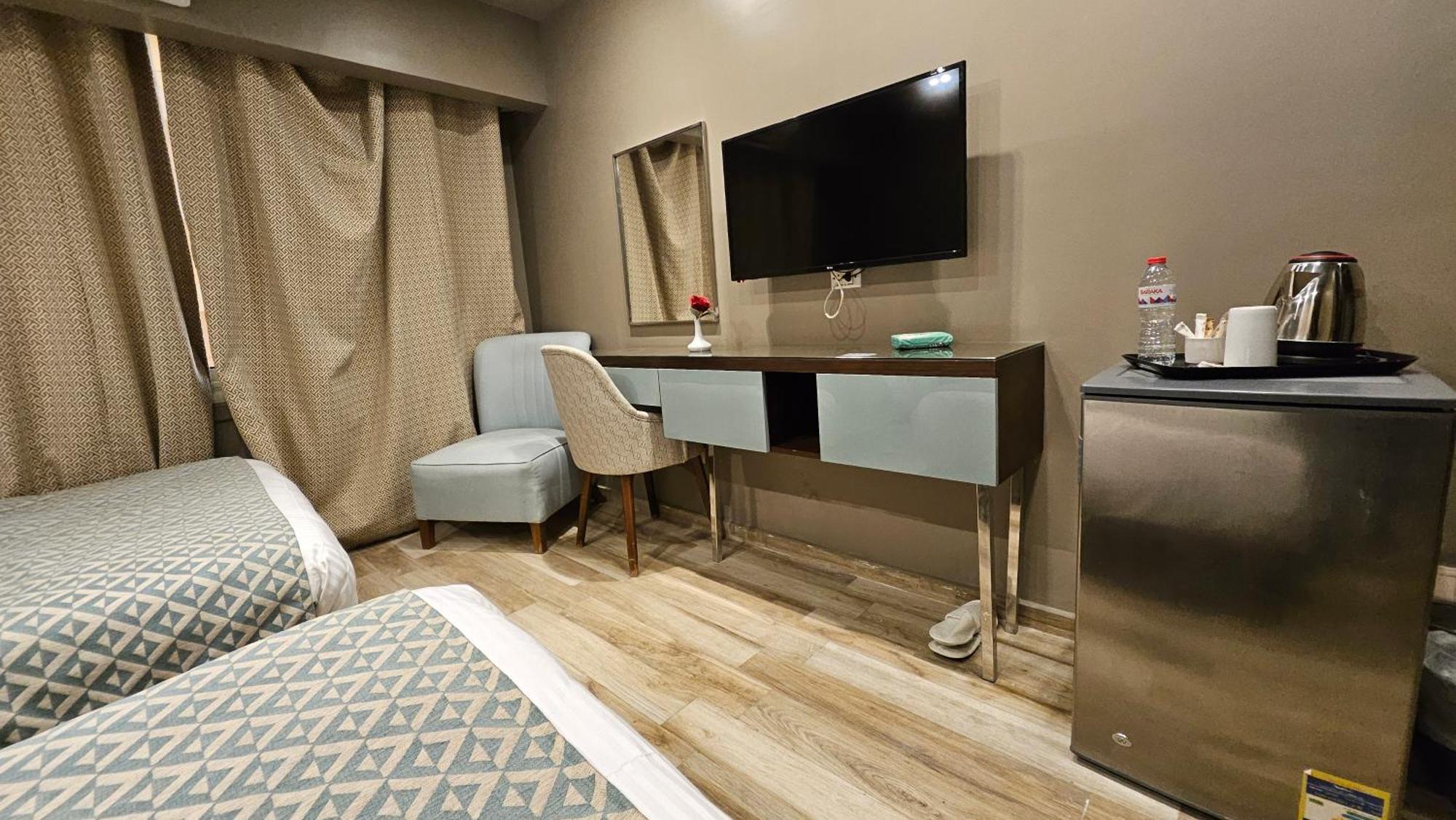 Grand Bayan Hotel & Apt At Nile Plaza カイロ 部屋 写真